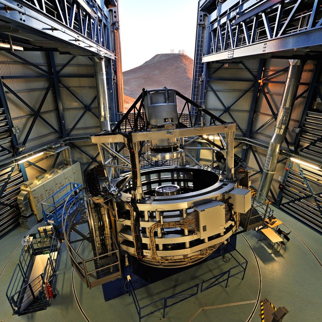 This spectacular view of the VISTA telescope was taken from the roof of the building during the opening of the enclosure at sunset. The VLT is visible on the neighbouring mountain. VISTA is the largest survey telescope in the world and it is dedicated to mapping the sky at near-infrared wavelengths. Its primary mirror is 4.1 metres in diameter and is the most highly curved of its size. The extremely high curvature reduces the focal length, making the structure of the telescope extremely compact. VISTA can map large areas of the sky quickly and deeply. #L